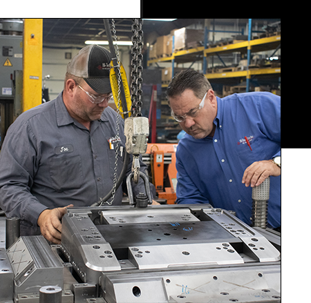 Two Men Working on a Tool and Die Machine